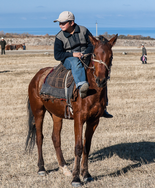 Young boy riding a Kyrgyz pony
