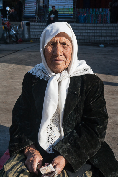 Elderly woman begging on the street in Turfan, Xinjiang