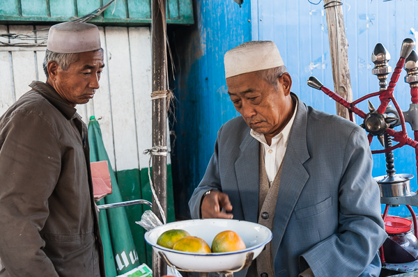 Buying fruit in Turfan, Xinjiang