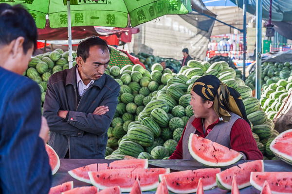 Chatting over the sale of watermelons in Turfan, Xinjiang