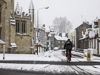 070208-2298 Man cycling through the snow in Cambridge.