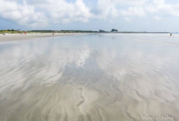 Sky reflected in retreating waves, Cape Canaveral