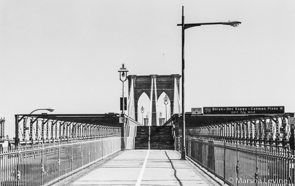 Walking across Brooklyn Bridge, New York City 
